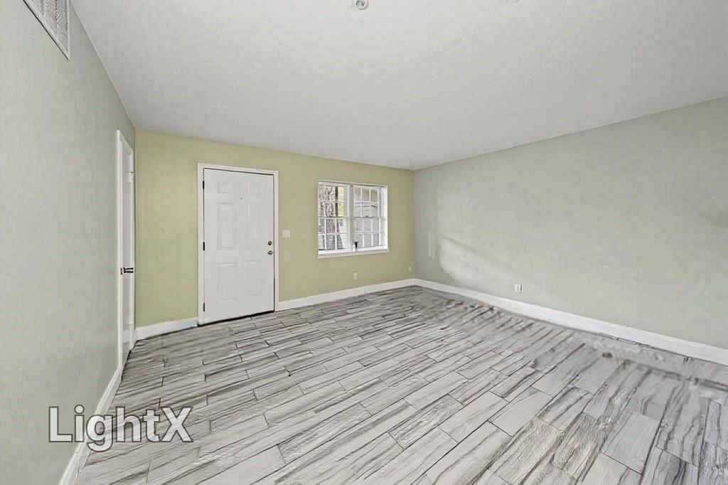 3087 Colonial Way, Unit J Atlanta, GA 30341 - Photo 14 of 21 wooden floor in an empty room