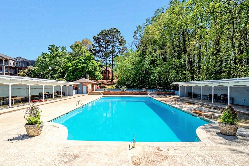 3087 Colonial Way, Unit J Atlanta, GA 30341 - Photo 18 of 21 a view of a house with pool yard and sitting area