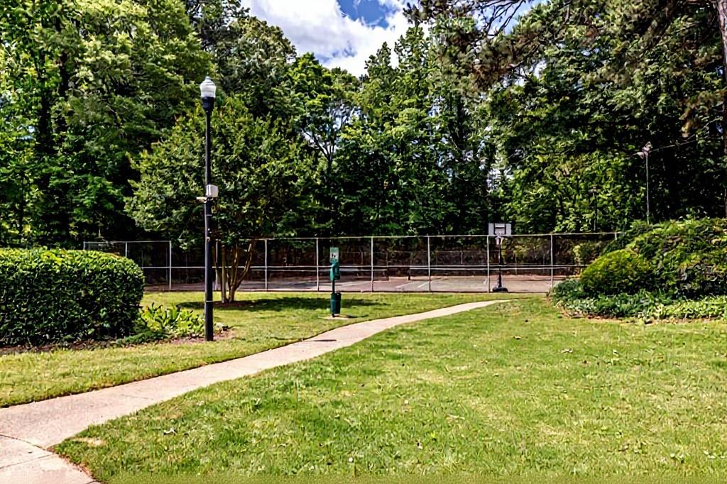 3087 Colonial Way, Unit J Atlanta, GA 30341 - Photo 20 of 21 a view of a backyard with swings