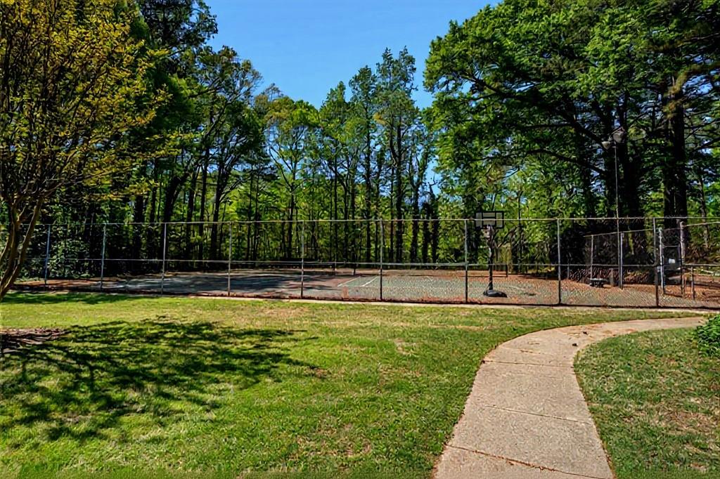 3087 Colonial Way, Unit J Atlanta, GA 30341 - Photo 21 of 21 a view of a swimming pool with a yard