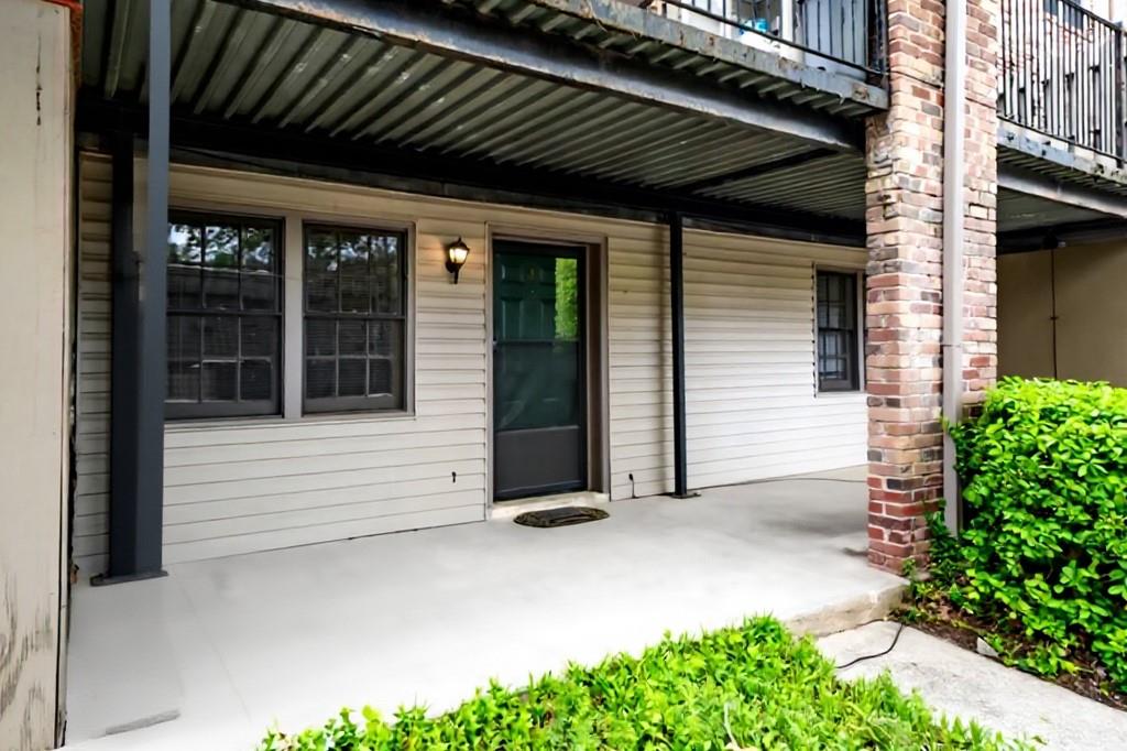 3087 Colonial Way, Unit J Atlanta, GA 30341 - Photo 3 of 21 a view of a house with a large window and yard