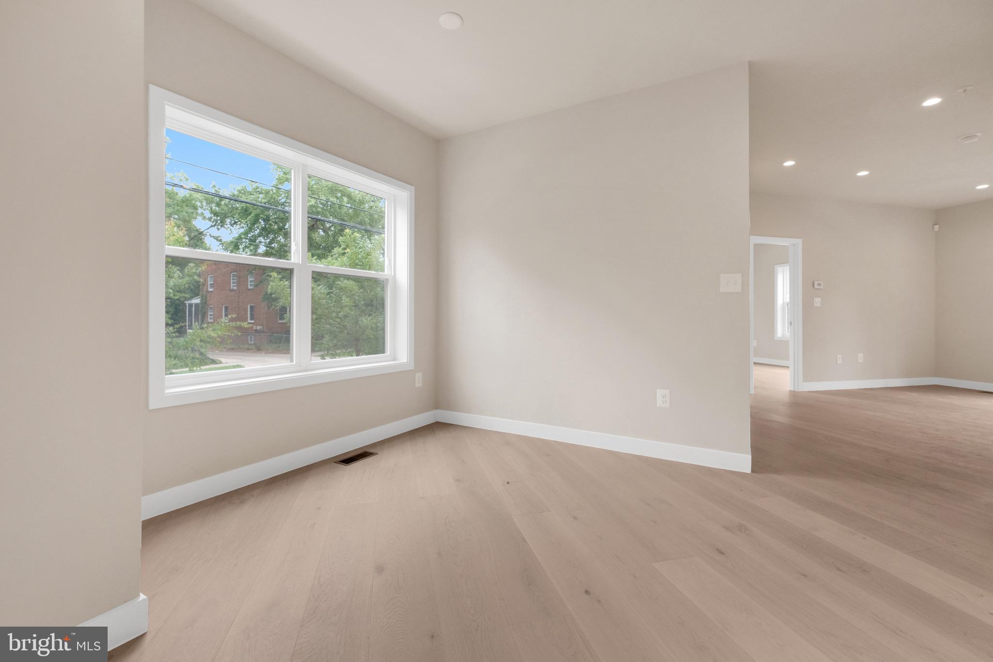 854 Xenia Street Southeast, Unit 102 Washington, DC 20032 - Photo 11 of 28 a view of an empty room with a window