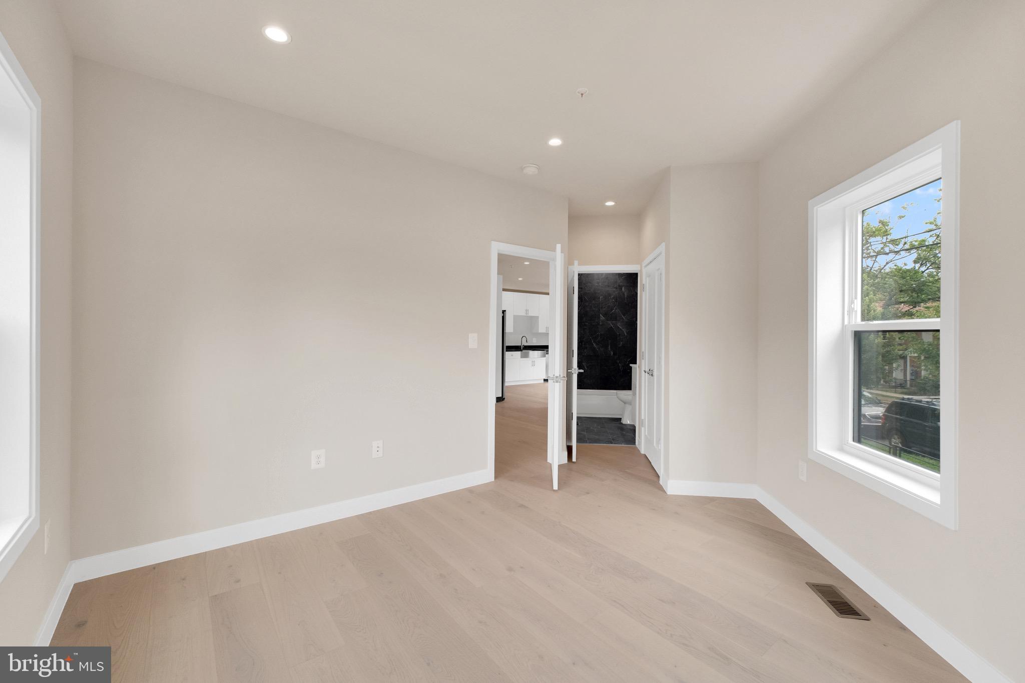 854 Xenia Street Southeast, Unit 102 Washington, DC 20032 - Photo 13 of 28 a view of an empty room with a window