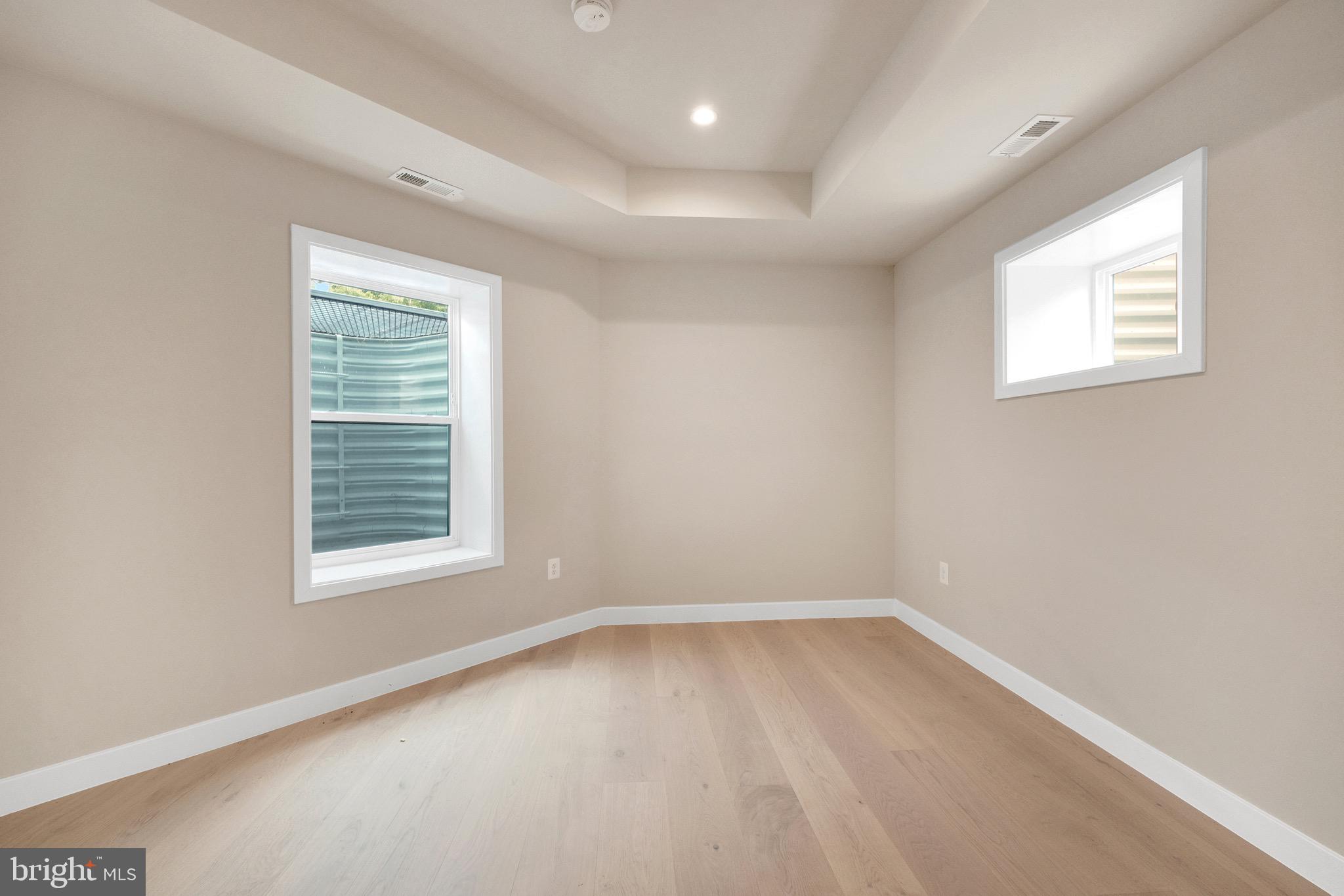 854 Xenia Street Southeast, Unit 102 Washington, DC 20032 - Photo 18 of 28 an empty room with a window