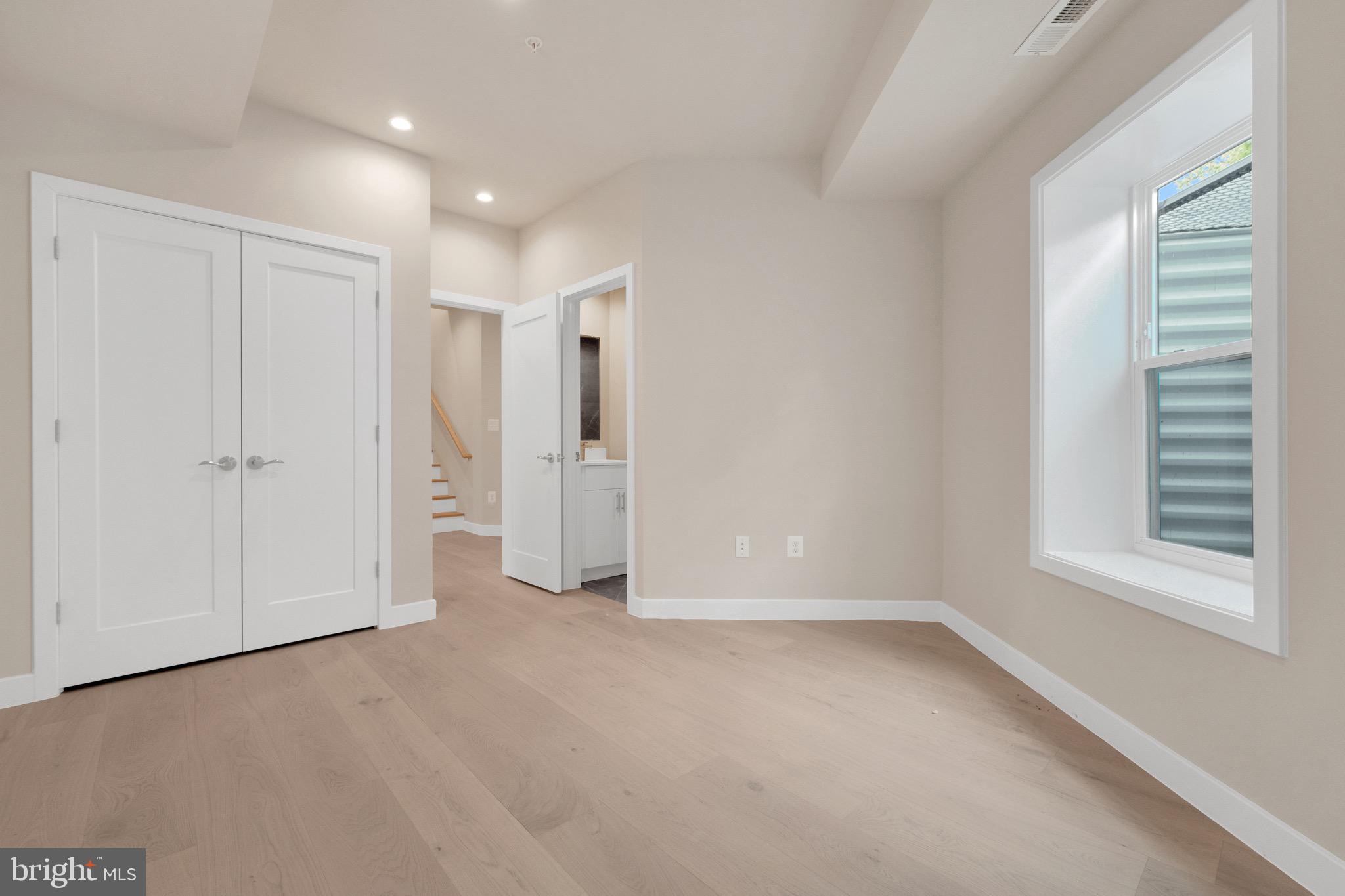 854 Xenia Street Southeast, Unit 102 Washington, DC 20032 - Photo 19 of 28 a view of an empty room with a window