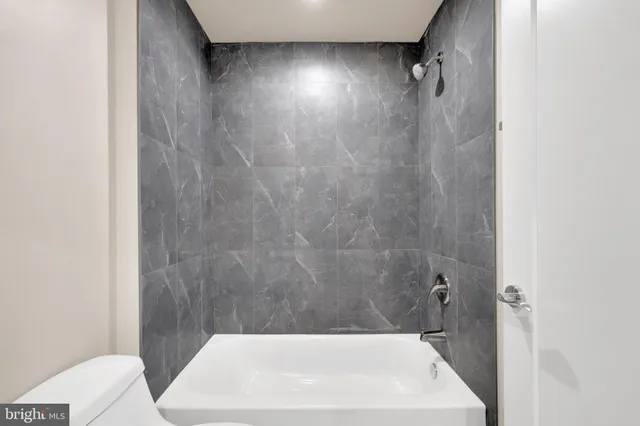 a bathroom with a white bath tub