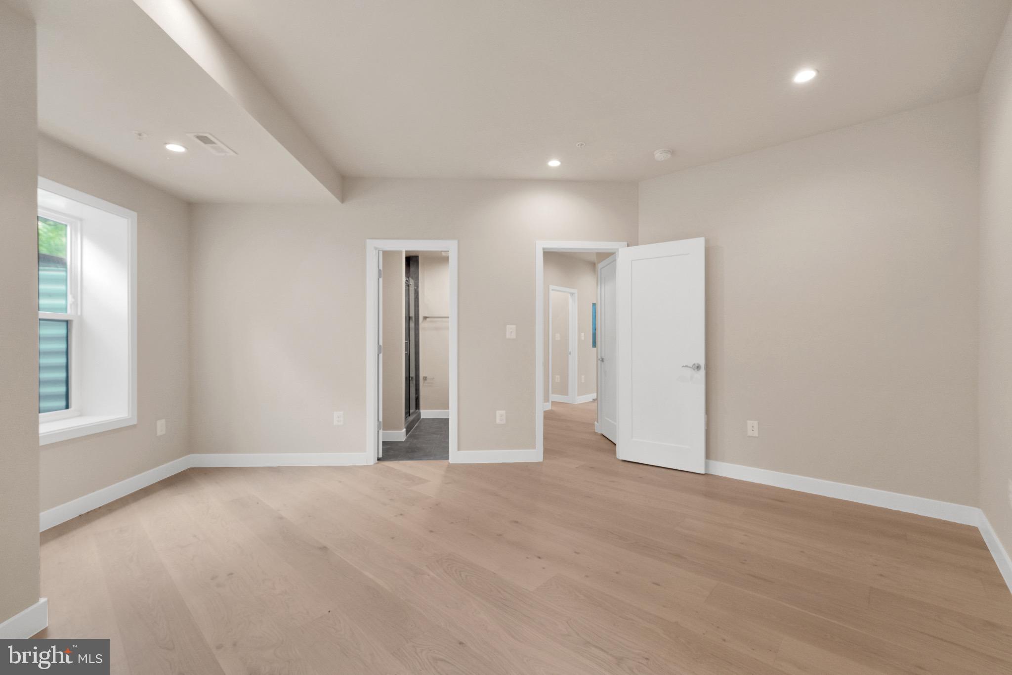 854 Xenia Street Southeast, Unit 102 Washington, DC 20032 - Photo 23 of 28 an empty room with windows and closet