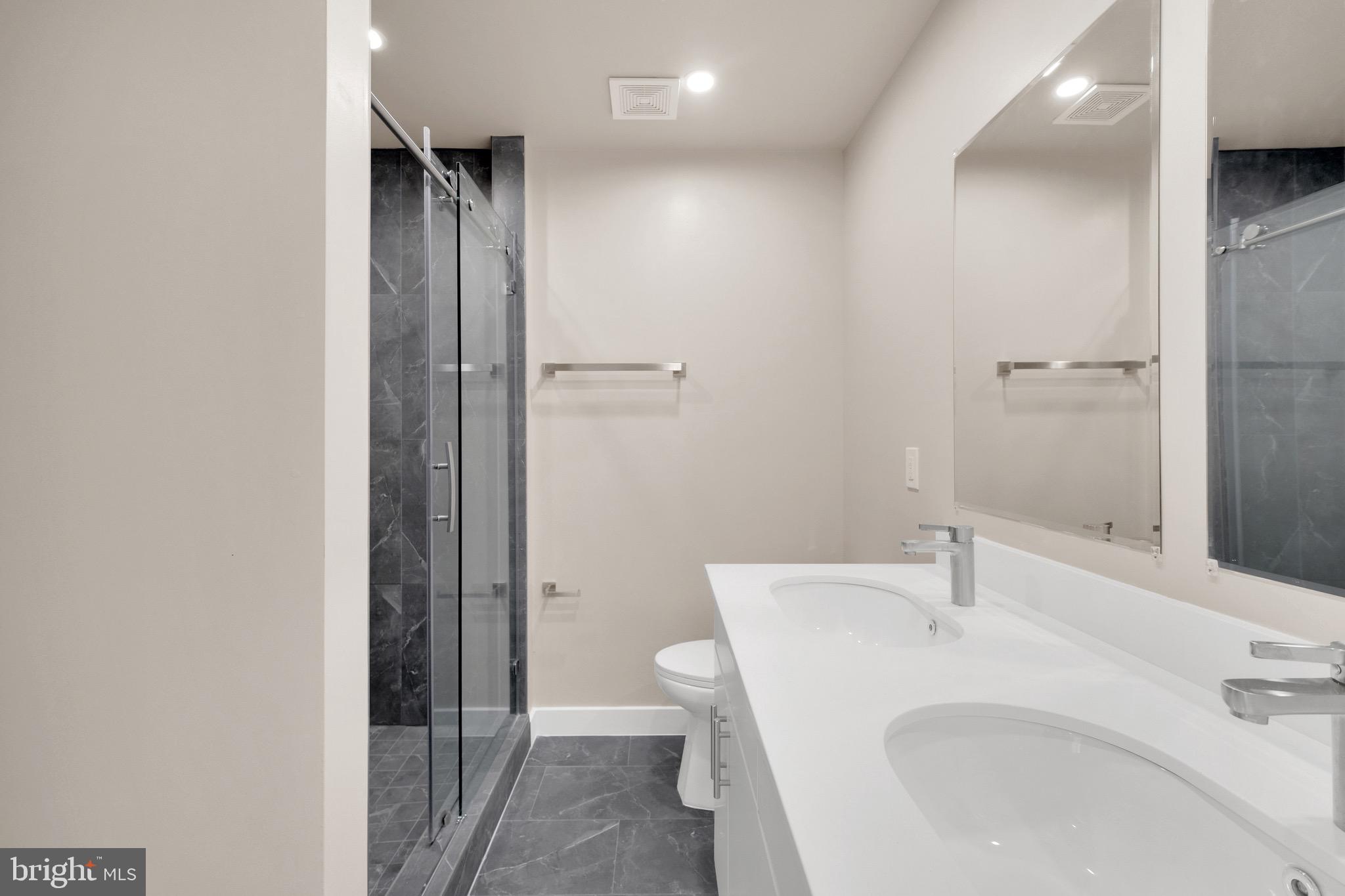 854 Xenia Street Southeast, Unit 102 Washington, DC 20032 - Photo 24 of 28 a bathroom with a sink and toilet