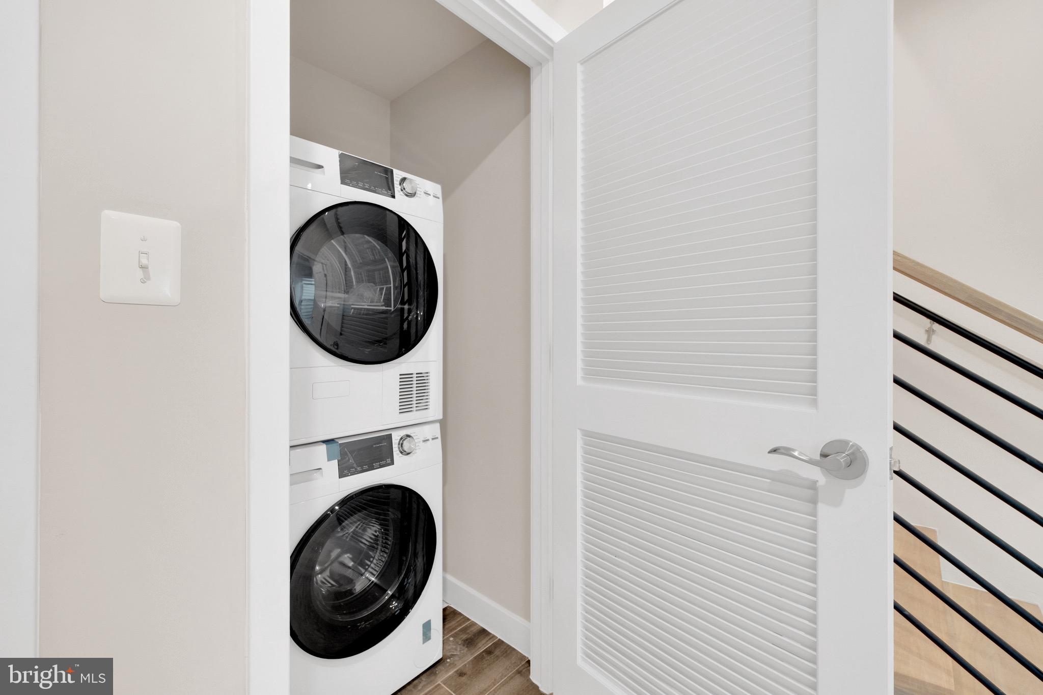854 Xenia Street Southeast, Unit 102 Washington, DC 20032 - Photo 27 of 28 a utility room with dryer and washer