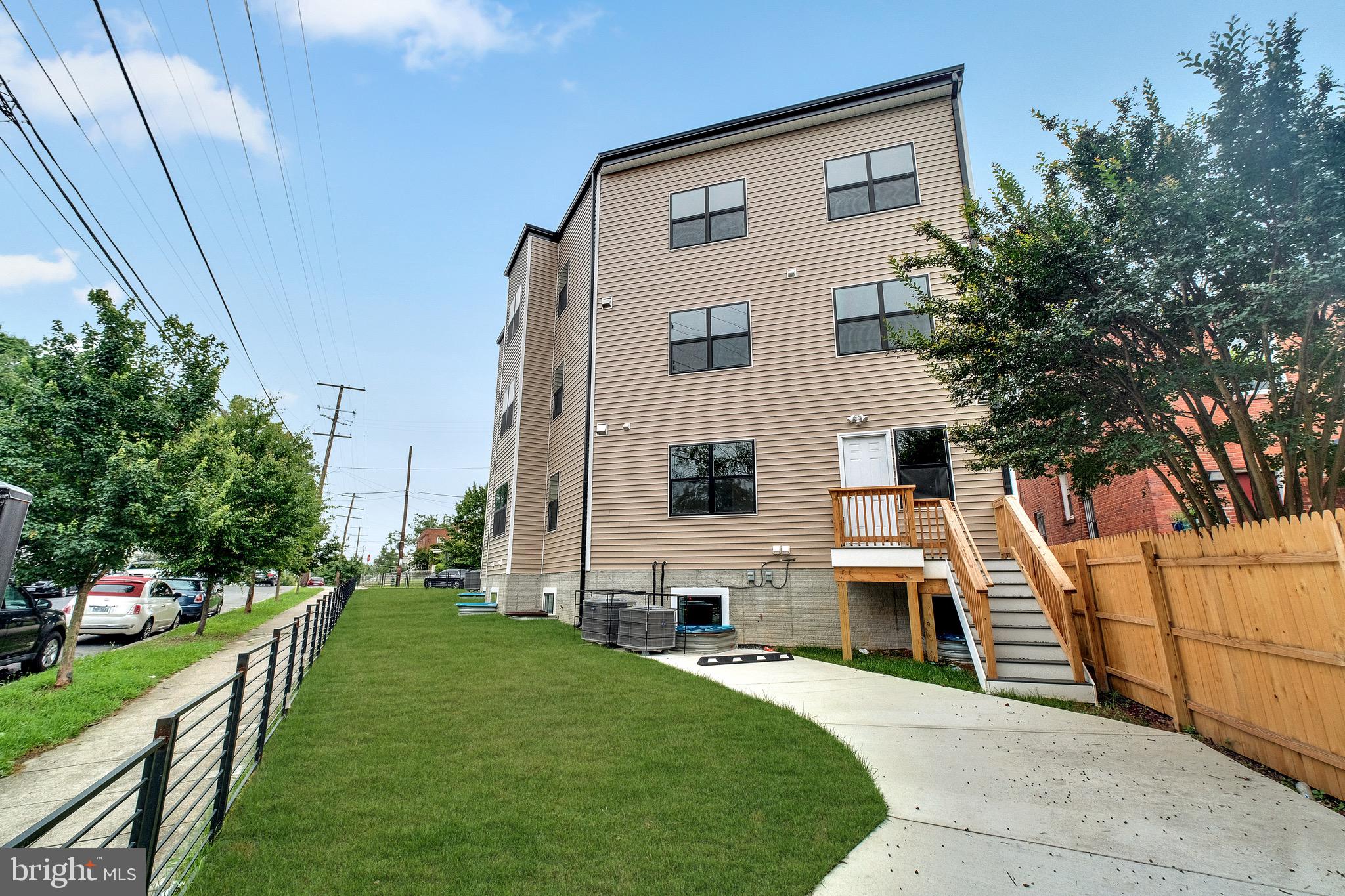 854 Xenia Street Southeast, Unit 102 Washington, DC 20032 - Photo 28 of 28 a front view of a house with a yard