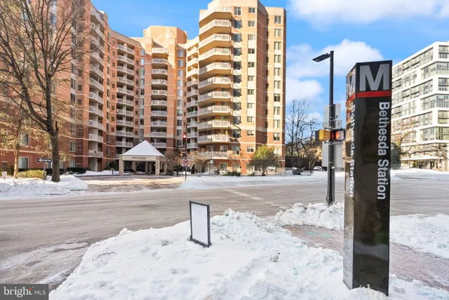 a blue sign that is on the side of a building