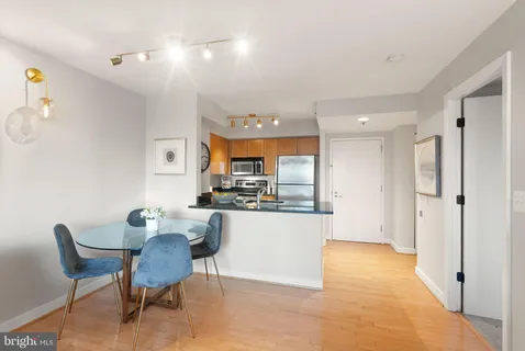 a kitchen with a table and chairs in it