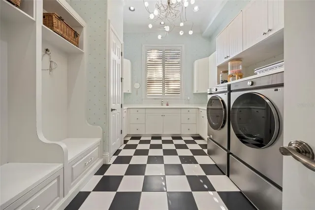 a large bathroom with a large tub and sink