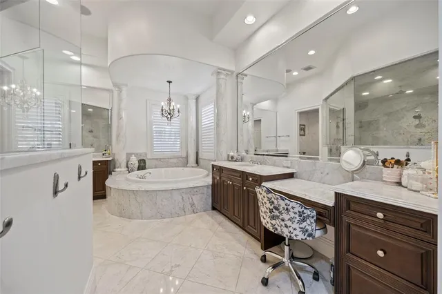 a bathroom with a granite countertop toilet sink and mirror