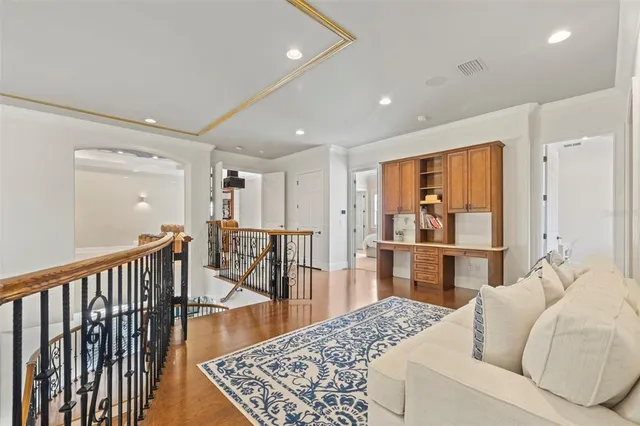 a view of a house with backyard swimming pool and sitting area