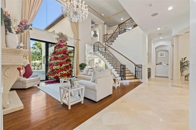 a living room with furniture and painting on the wall