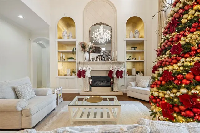 a view of a dining room with furniture and chandelier
