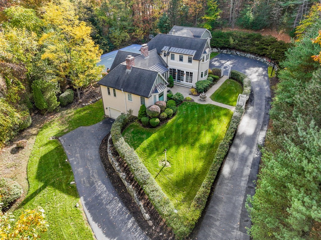 130 Summer Street Weston, MA 02493 - Photo 1 of 26 an aerial view of a house with a garden and large trees