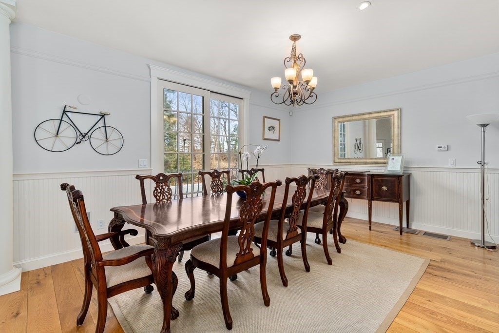 130 Summer Street Weston, MA 02493 - Photo 11 of 26 a view of a dining room with furniture and chandelier