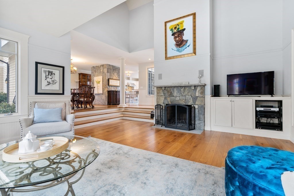 130 Summer Street Weston, MA 02493 - Photo 13 of 26 a living room with furniture a fireplace and a flat screen tv