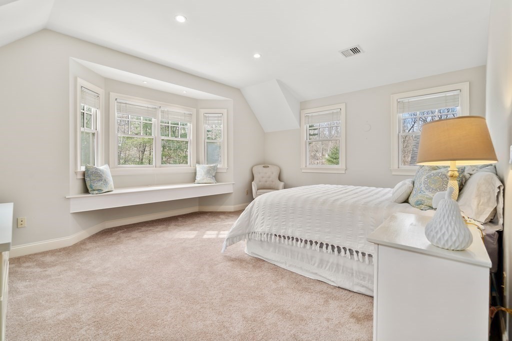 130 Summer Street Weston, MA 02493 - Photo 18 of 26 a spacious bedroom with a bed and a window