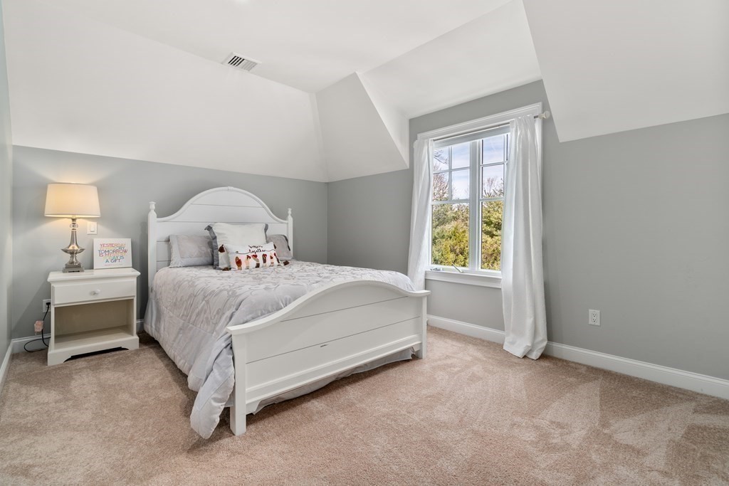 130 Summer Street Weston, MA 02493 - Photo 19 of 26 a bedroom with a bed and a window