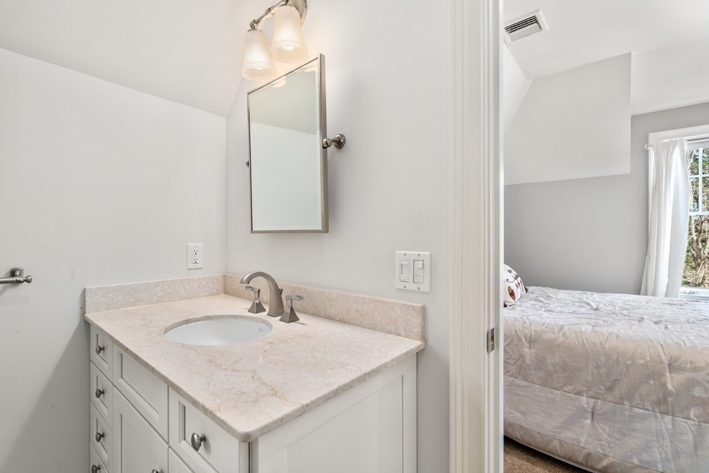 130 Summer Street Weston, MA 02493 - Photo 20 of 26 a bathroom with a sink and a mirror