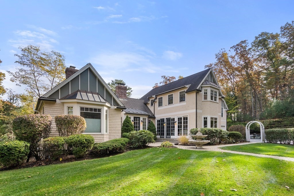 130 Summer Street Weston, MA 02493 - Photo 2 of 26 a view of a house with swimming pool next to a yard