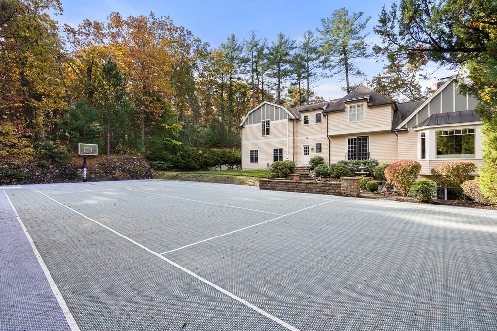 130 Summer Street Weston, MA 02493 - Photo 8 of 26 a front view of a house with a yard and outdoor seating