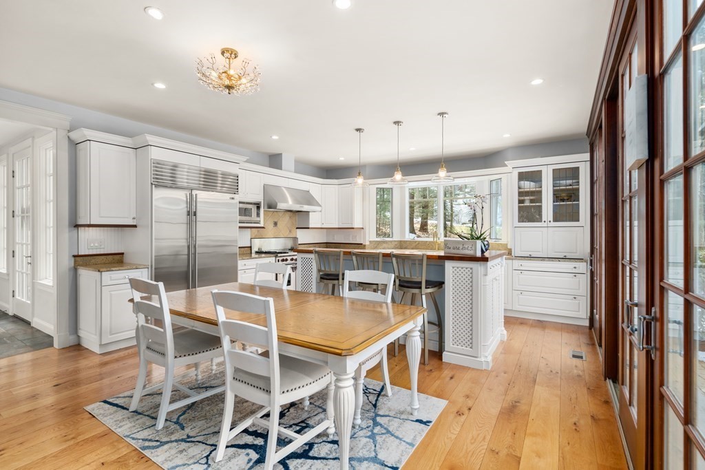 130 Summer Street Weston, MA 02493 - Photo 9 of 26 a kitchen with kitchen island a large counter top space and stainless steel appliances