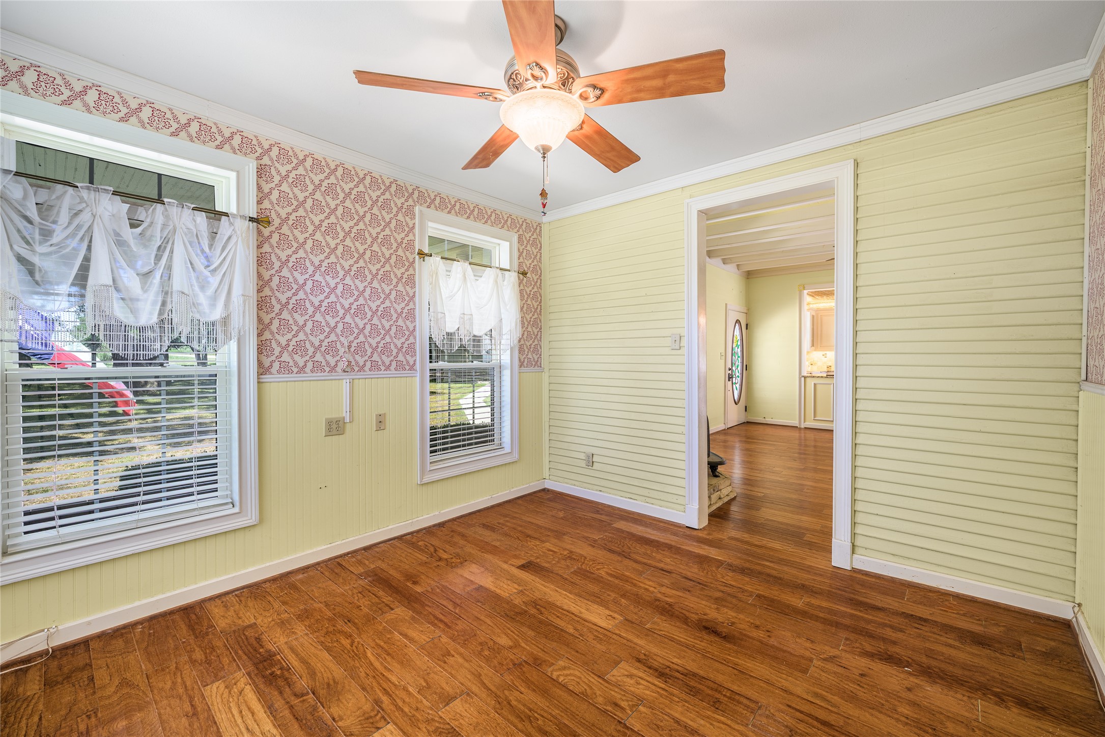 2020 South Knezek Road Flatonia, TX 78941 - Photo 12 of 25 a view of an empty room with window and wooden floor