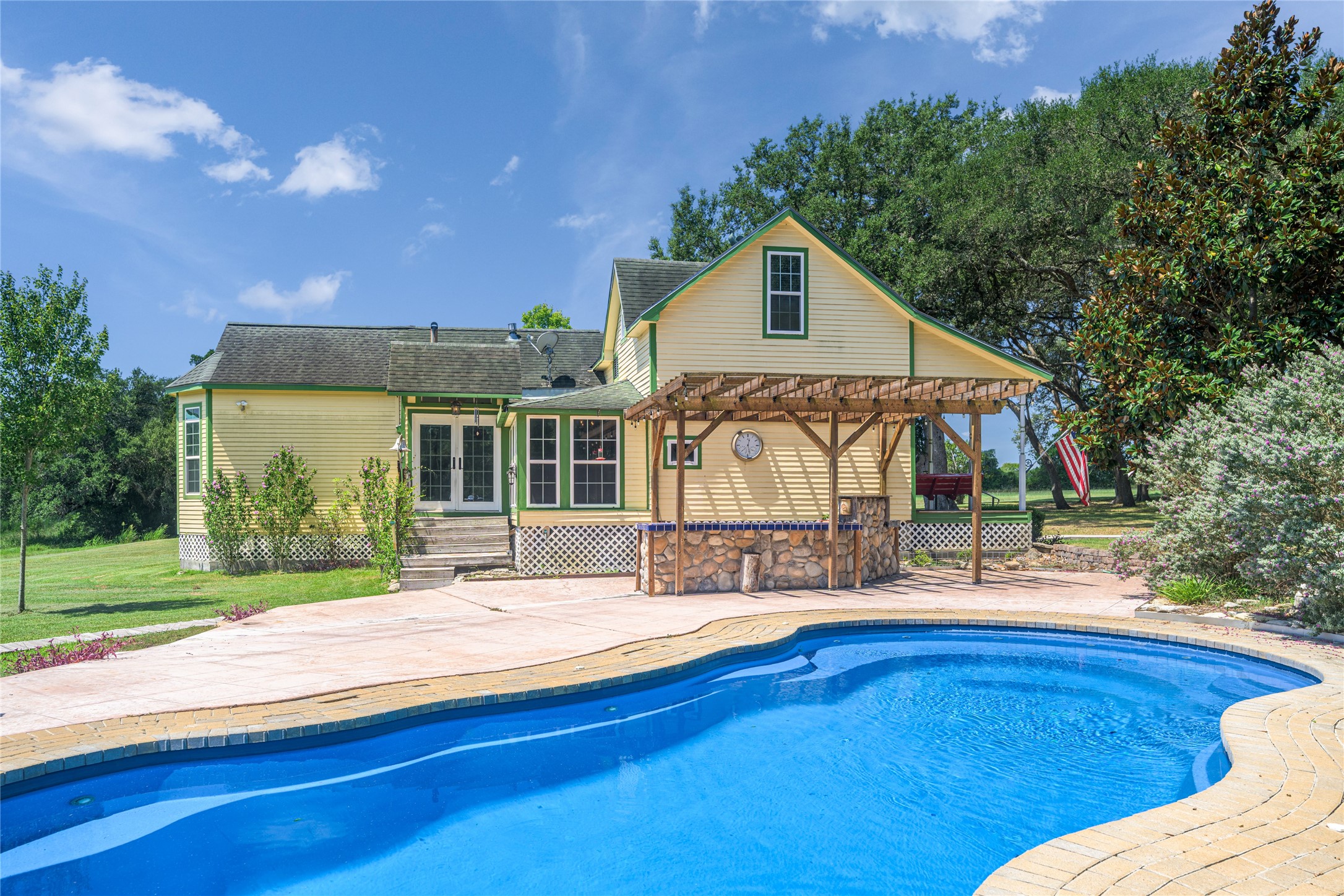 2020 South Knezek Road Flatonia, TX 78941 - Photo 15 of 25 a view of a house with wooden deck and sitting area