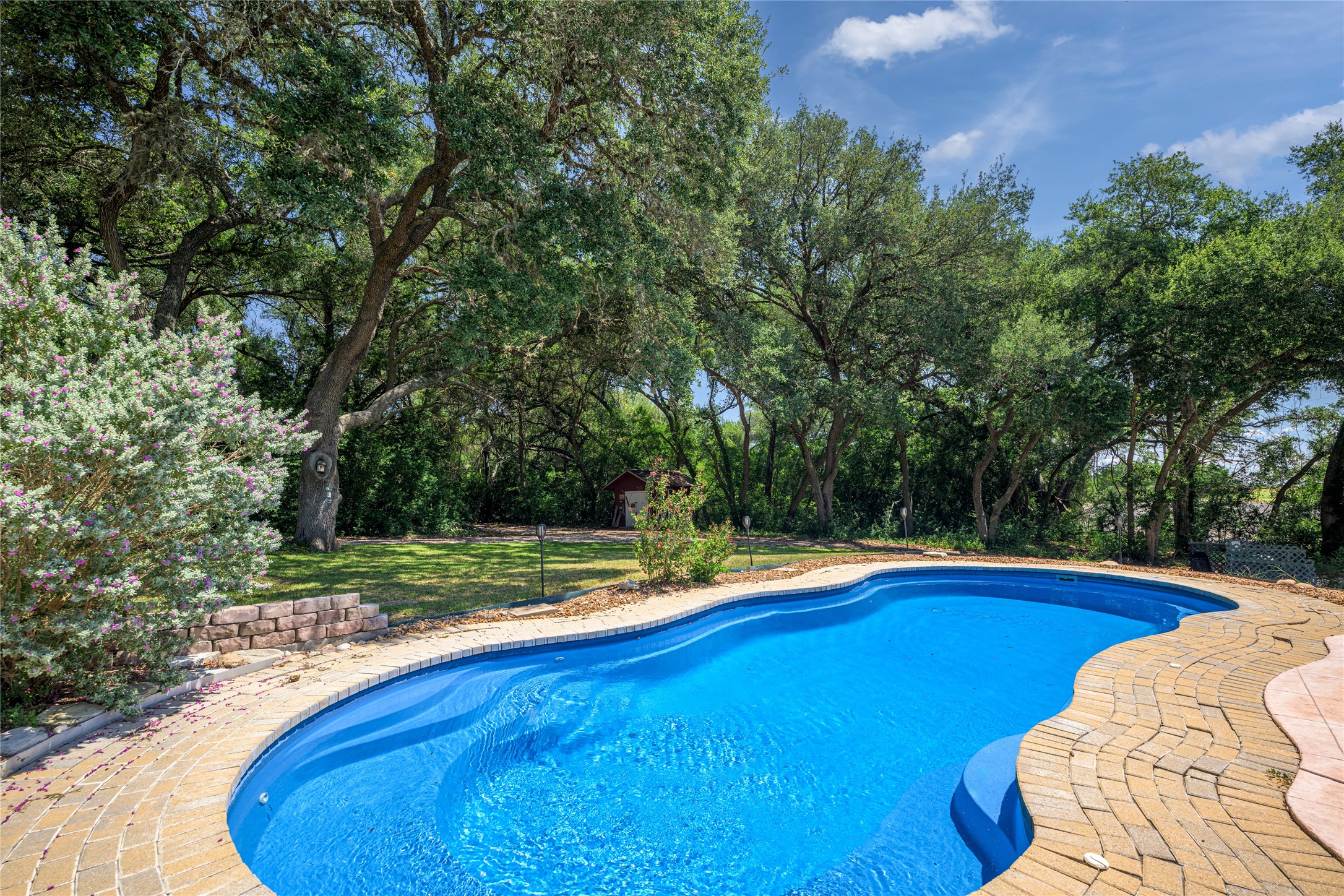 2020 South Knezek Road Flatonia, TX 78941 - Photo 16 of 25 a view of a swimming pool with an outdoor space and seating area