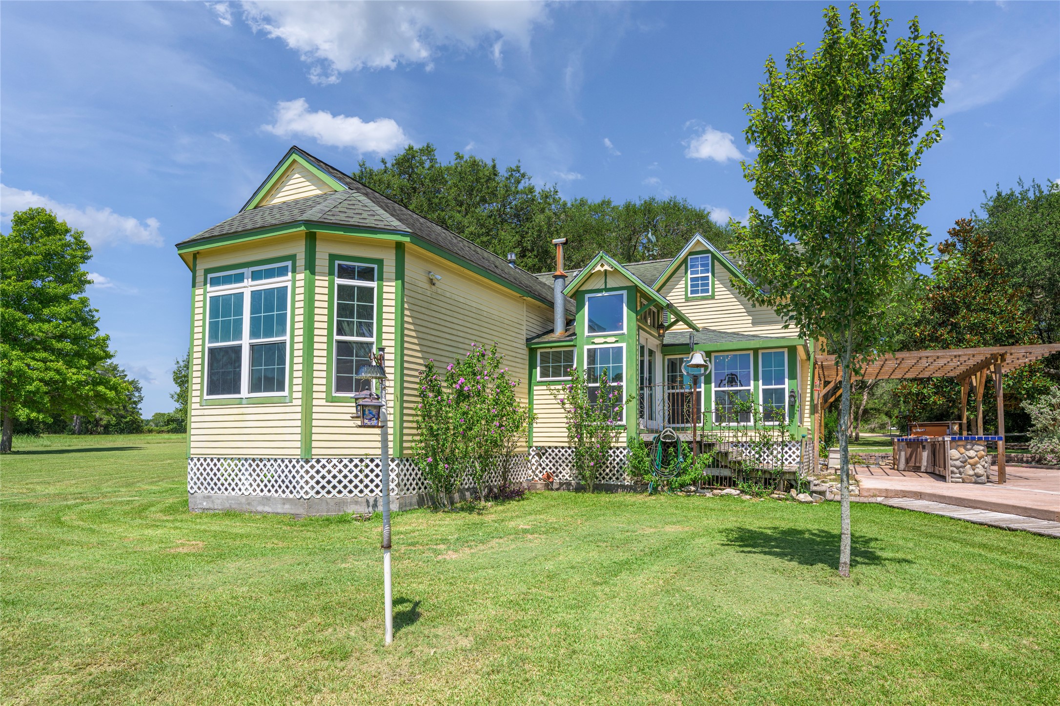 2020 South Knezek Road Flatonia, TX 78941 - Photo 19 of 25 a front view of a house with a yard and potted plants