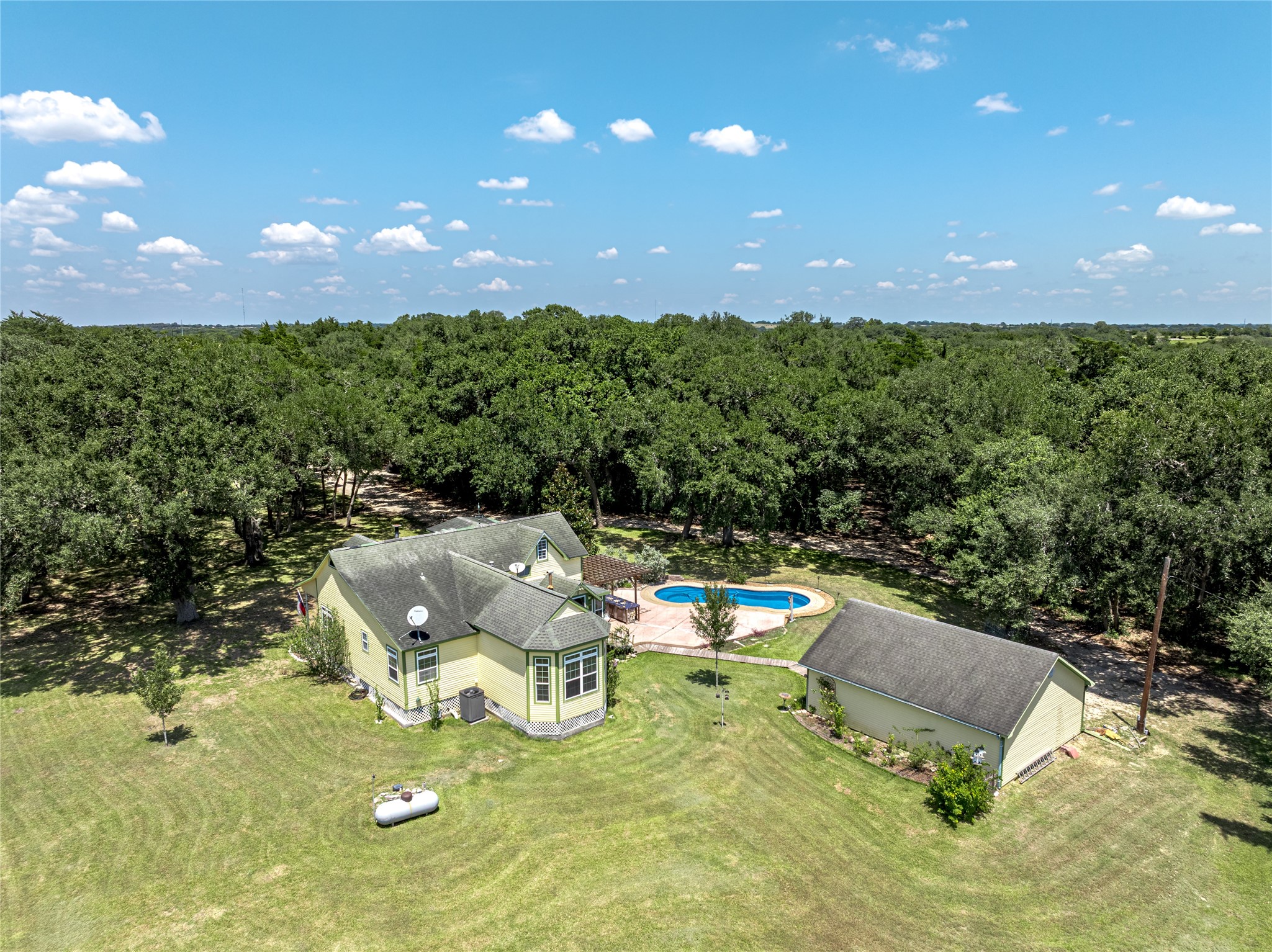 2020 South Knezek Road Flatonia, TX 78941 - Photo 23 of 25 a view of a swimming pool with lawn chairs