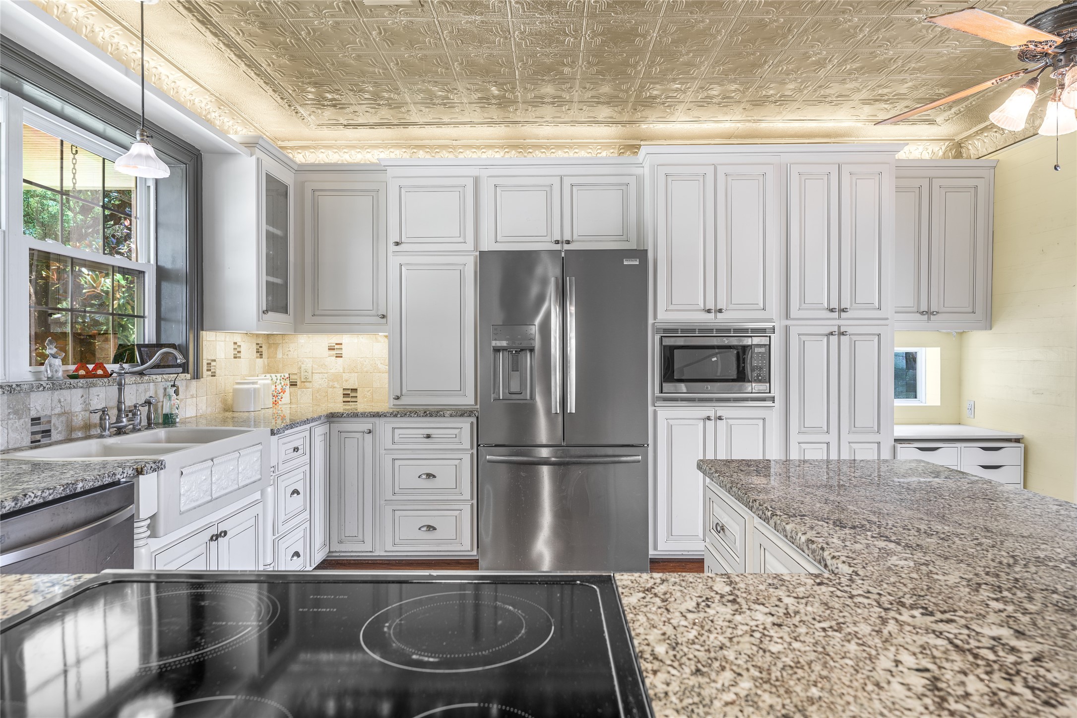 2020 South Knezek Road Flatonia, TX 78941 - Photo 6 of 25 a kitchen with stainless steel appliances granite countertop a refrigerator a stove and a sink