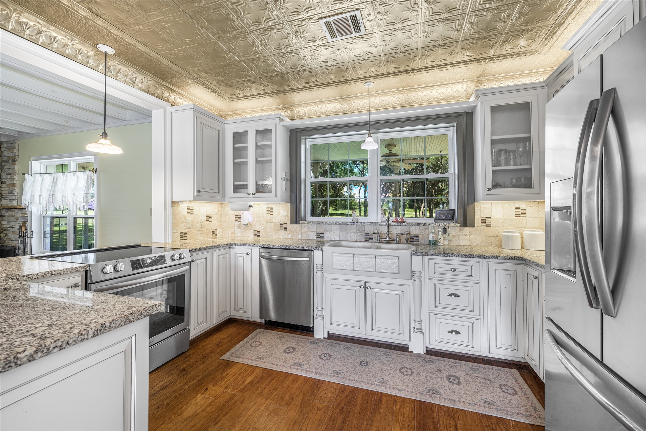 2020 South Knezek Road Flatonia, TX 78941 - Photo 7 of 25 a kitchen with granite countertop a sink stainless steel appliances and cabinets