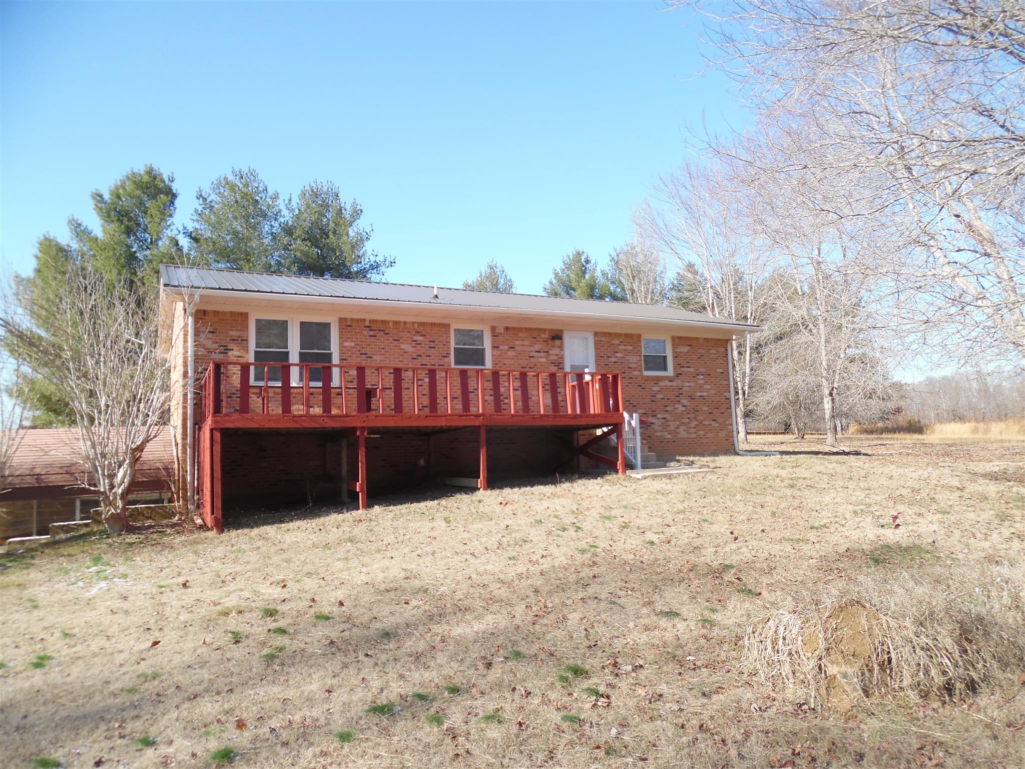 0 Frank Road Leoma, TN 38468 - Photo 3 of 18 a view of wooden house with a yard covered with snow in front of house