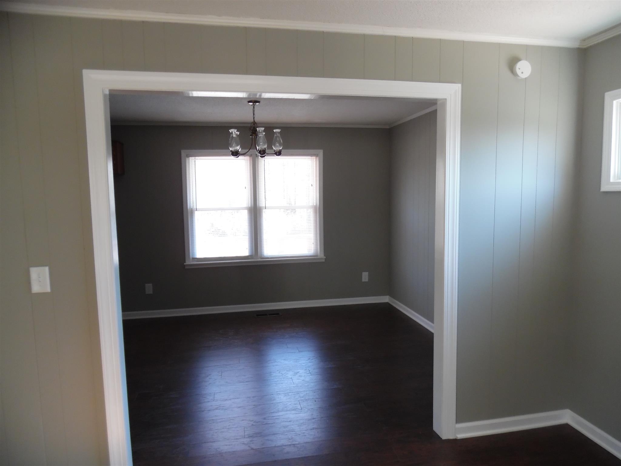 0 Frank Road Leoma, TN 38468 - Photo 7 of 18 an empty room with wooden floor and windows