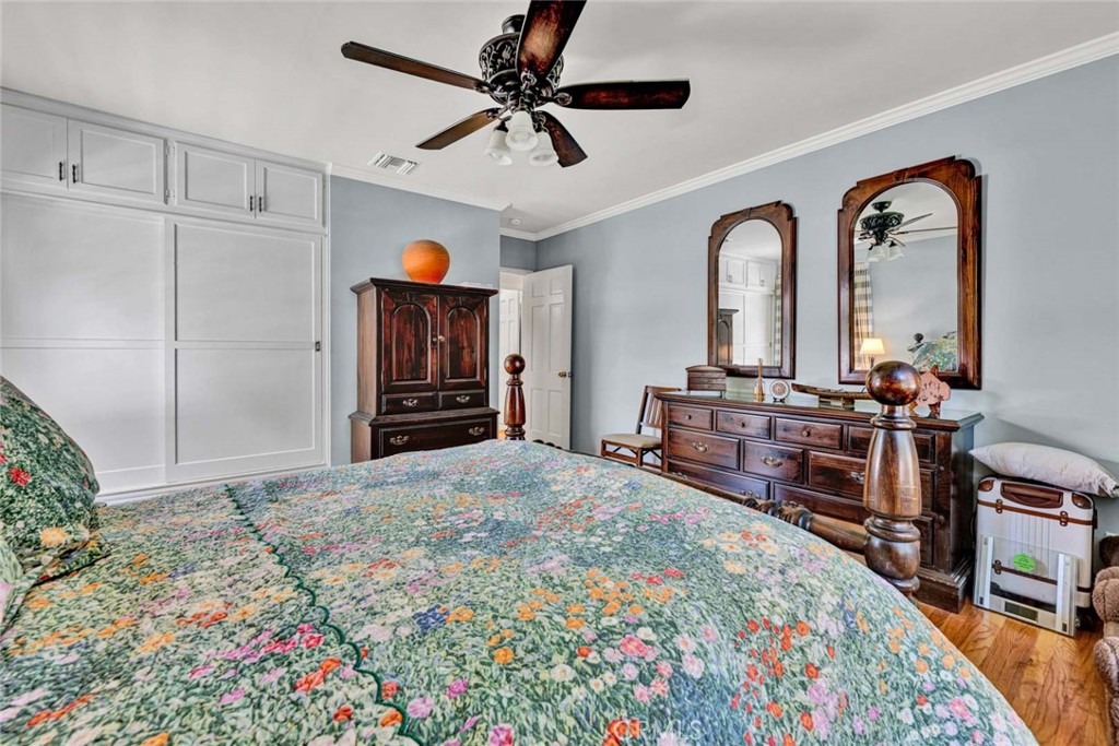 5456 Cadbury Road Whittier, CA 90601 - Photo 47 of 67 a bedroom with bed and wooden floor