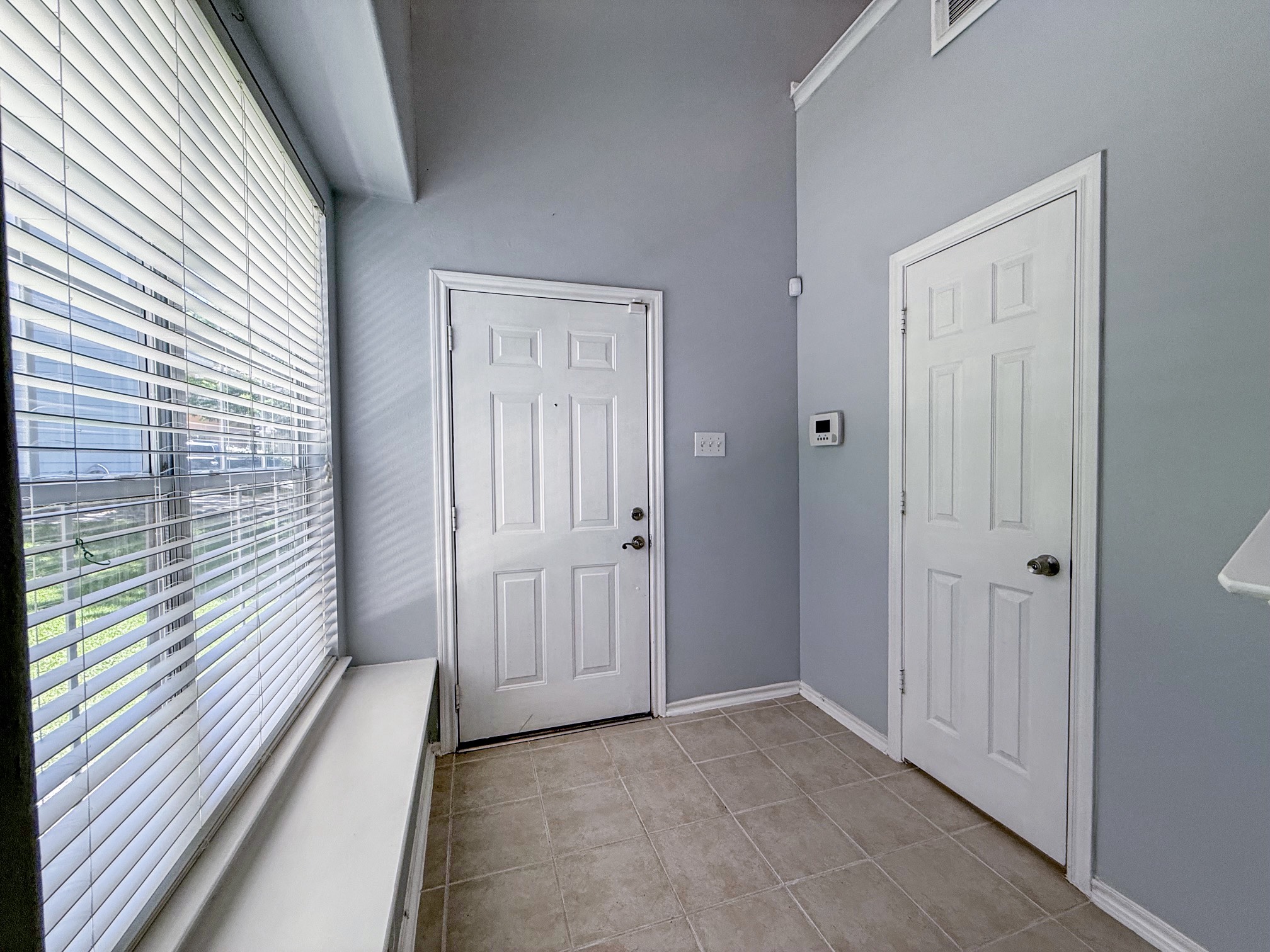 3 Peach Ridge Place The Woodlands, TX 77382 - Photo 10 of 22 a view of a hallway with wooden floor