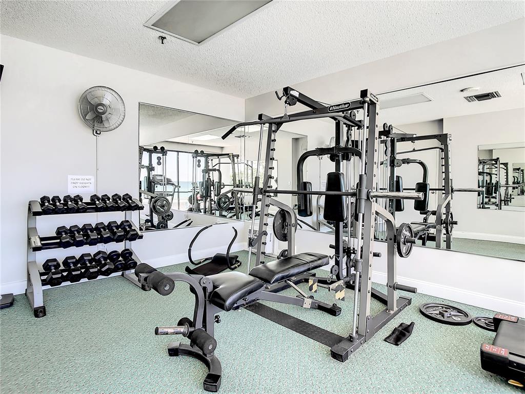 15462 Gulf Boulevard, Unit 501 Madeira Beach, FL 33708 - Photo 37 of 88 a view of a room with gym equipment