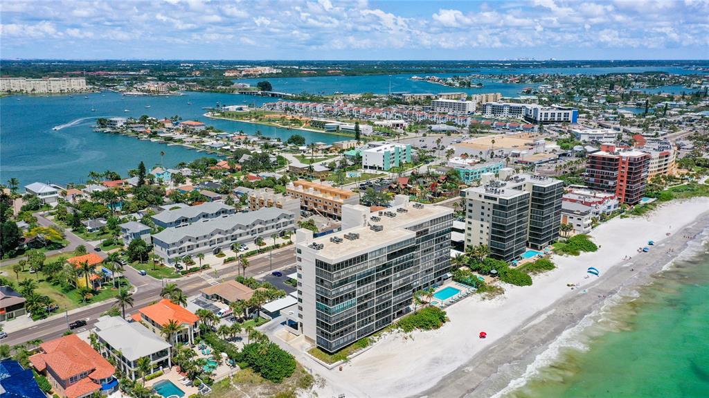 15462 Gulf Boulevard, Unit 501 Madeira Beach, FL 33708 - Photo 40 of 88 an aerial view of a city with lots of residential buildings ocean and mountain view in back