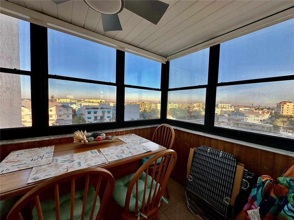 15462 Gulf Boulevard, Unit 501 Madeira Beach, FL 33708 - Photo 59 of 88 a view of a dining room with furniture large window and outside view