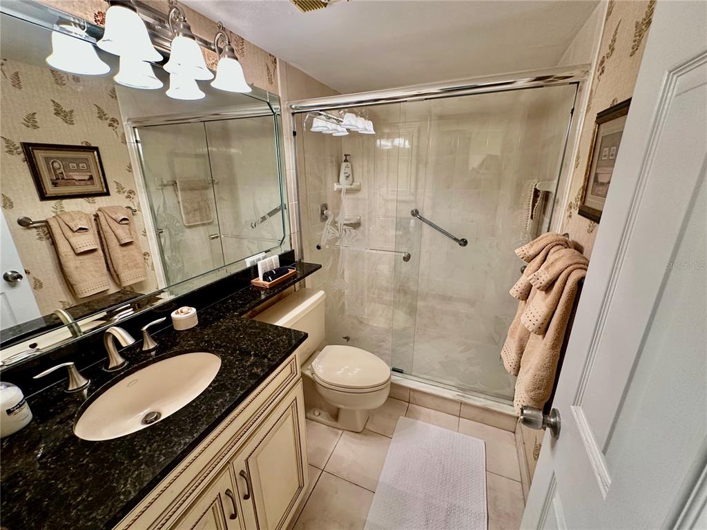 15462 Gulf Boulevard, Unit 501 Madeira Beach, FL 33708 - Photo 76 of 88 a bathroom with a sink toilet and shower