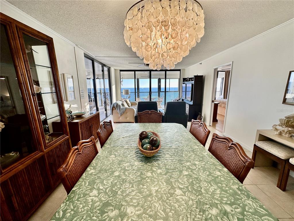 15462 Gulf Boulevard, Unit 501 Madeira Beach, FL 33708 - Photo 80 of 88 a living room with furniture and a floor to ceiling window