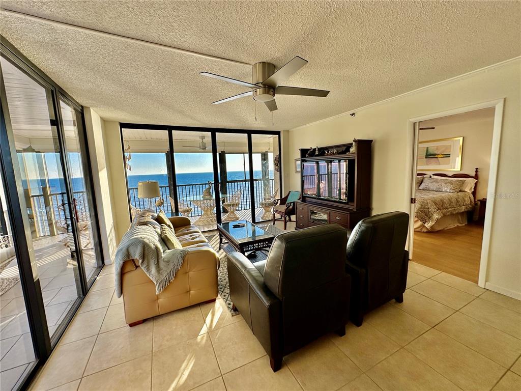 15462 Gulf Boulevard, Unit 501 Madeira Beach, FL 33708 - Photo 82 of 88 a living room with furniture and a large window