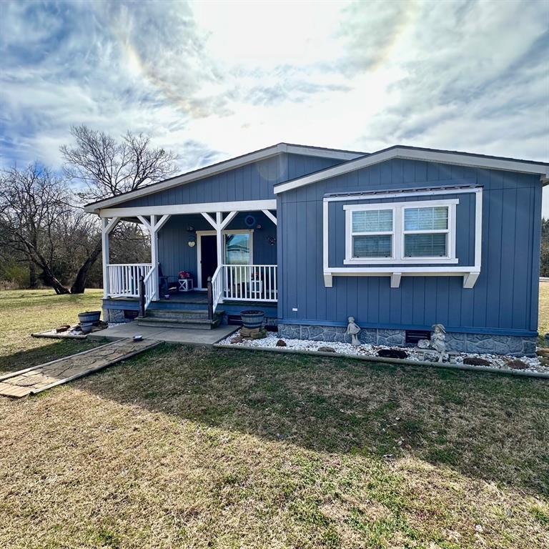 a view of a yard in front of a house