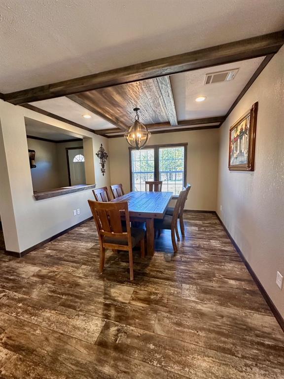 344 JP Cave Road Sherman, TX 75090 - Photo 12 of 21 a view of a dining room with furniture window and wooden floor