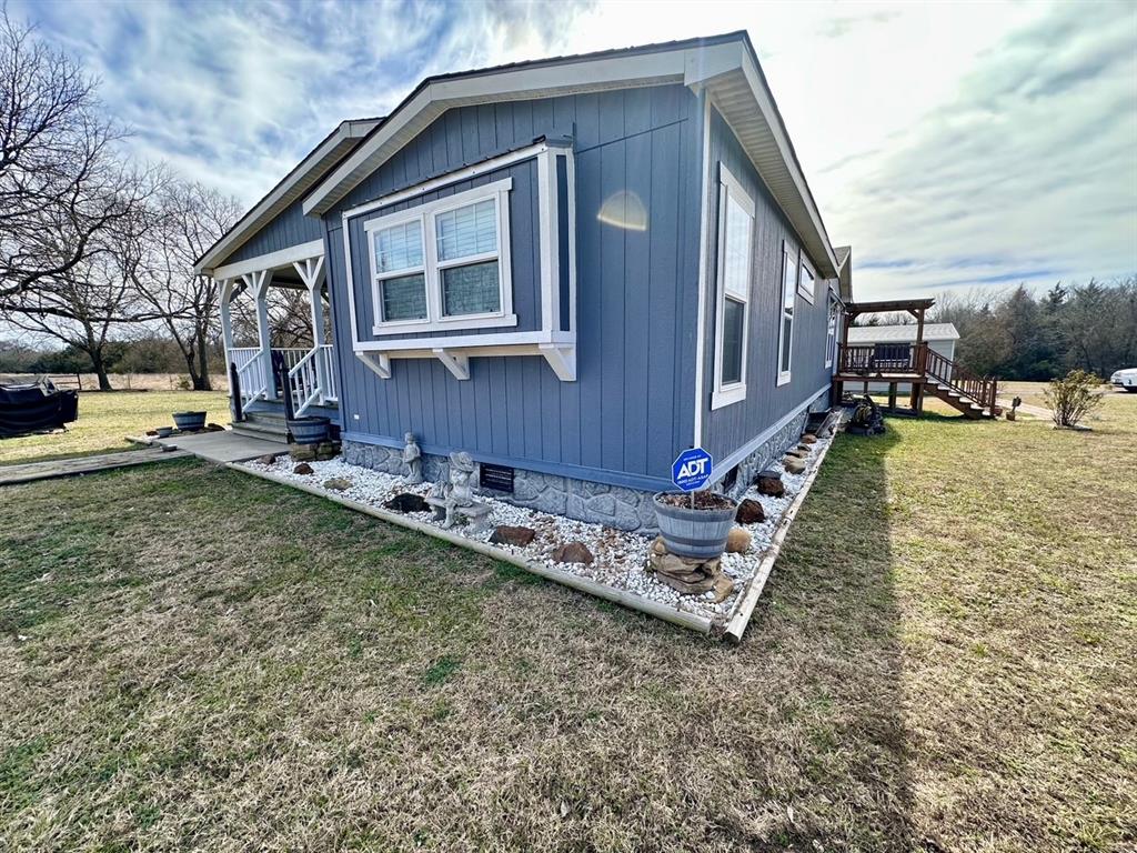 344 JP Cave Road Sherman, TX 75090 - Photo 2 of 21 a front view of a house with garden